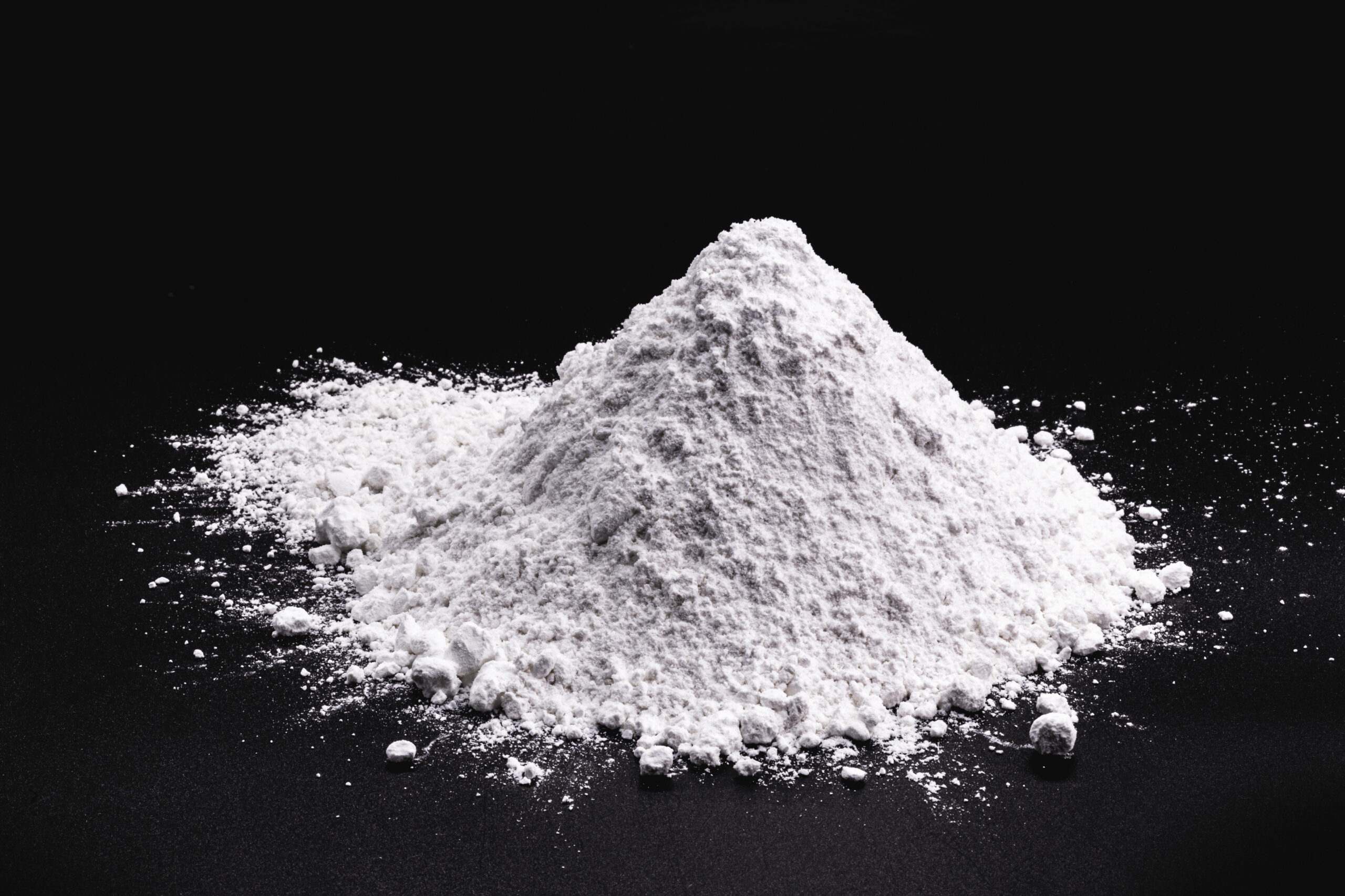 Image of white fumed silica on black background, lubricants, additives